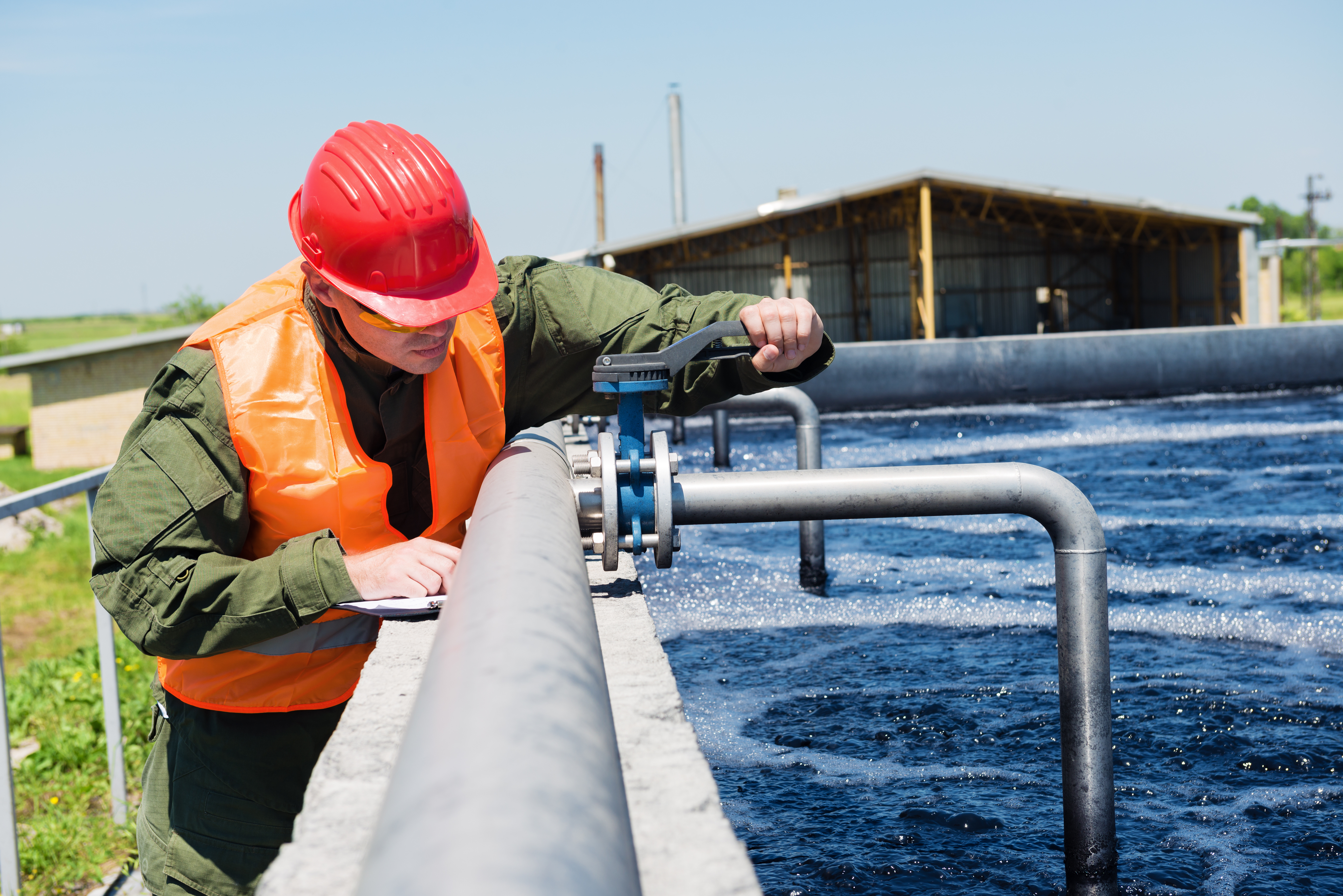 Worker adjusting airflow to aerators